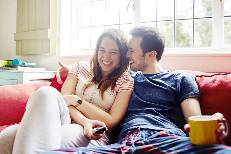 romantic couple sitting on a couch